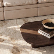 Avia gray abstract rug beneath the coffee table — lifestyle scene