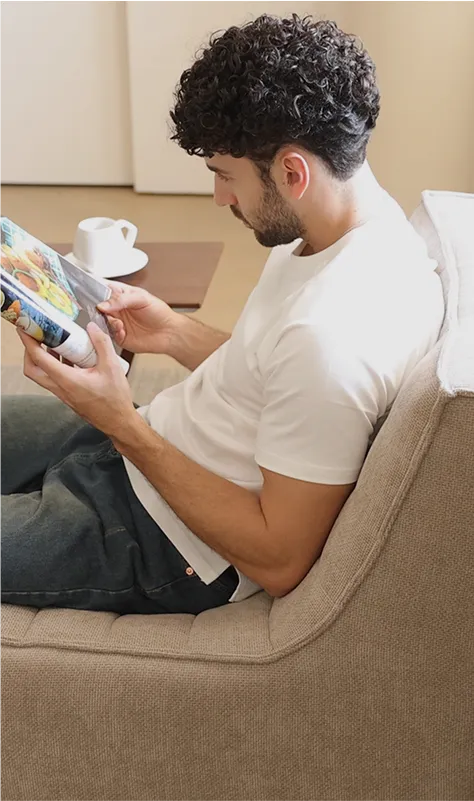 Caterpillar Classic Armless Sofa Stretching Out Position