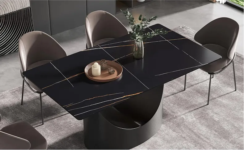 Urban Loft Style Dining Area with White Top and Black Leg Dining Table Under Edison Bulbs